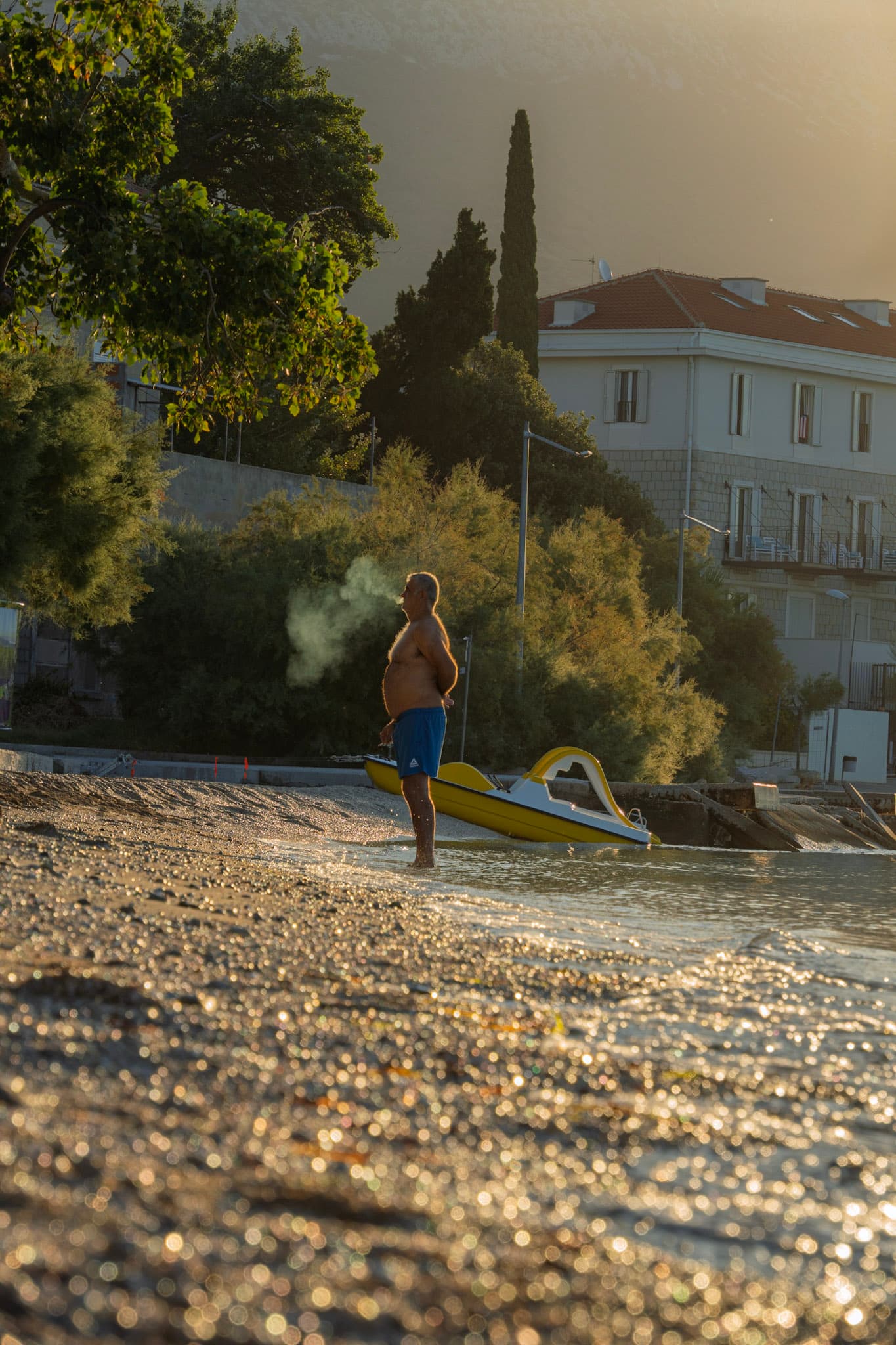 Guy enjoying a morning cigarette photo.